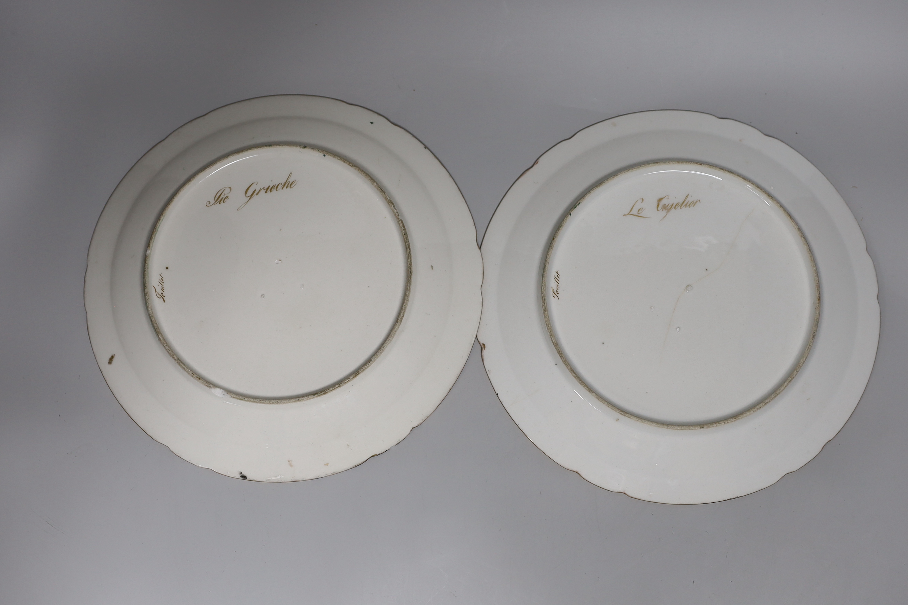 A pair of early 19th century Paris porcelain ornithological plates each painted by Jean-Pierre Feuillet, signed in gold Feuiilet, each painted with a bird, named verso, 24cm